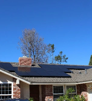 Brick-front California home with rooftop solar panels