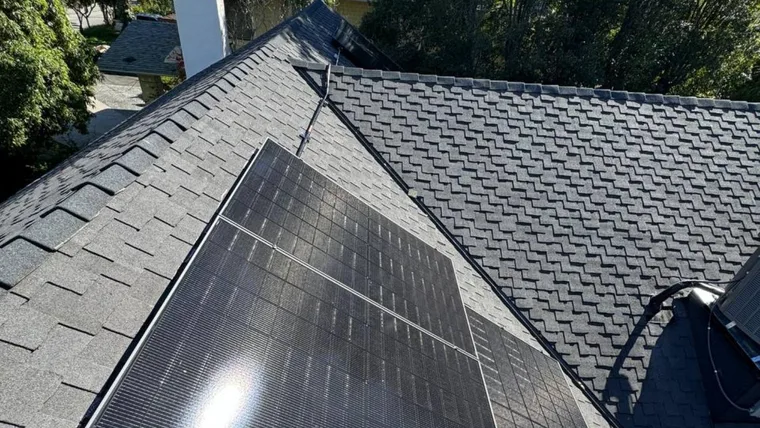 Sergey A.'s home: all-black solar panels on a shingle roof, installed by Green Conception